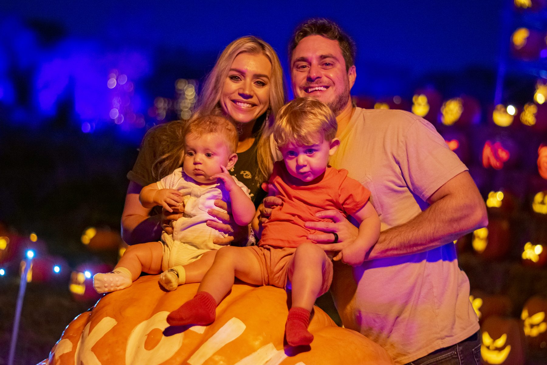 A family with young children on the lit quarry trail